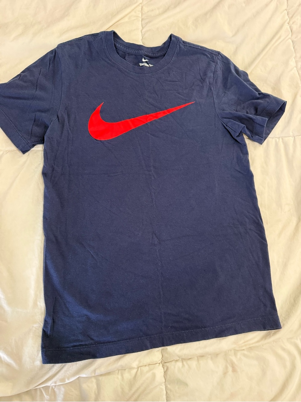Nike Men’s Navy Short Sleeve Tee with Red Swoosh